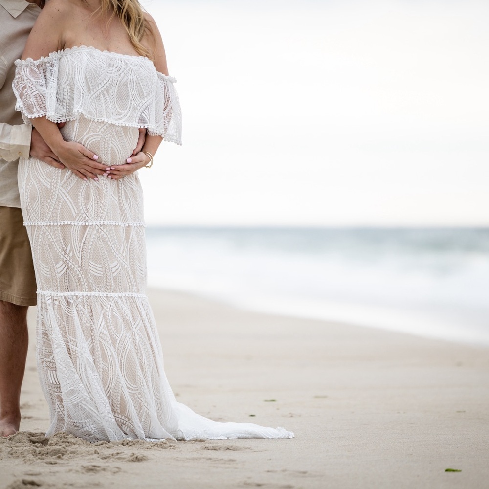 White lace dress with tan underlayer. Only worn for maternity photos.